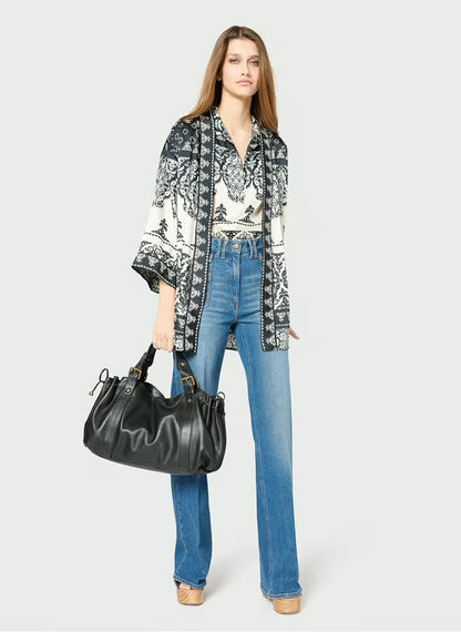 Woman carrying Miami Bag Black leather street style
