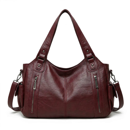 Malibu Bag in burgundy leather, spacious duffel for travel and daily use