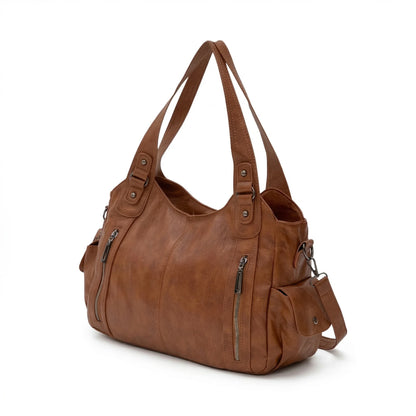 Malibu Bag in brown leather, spacious duffel style with multiple zippered compartments, ideal for travel and daily use